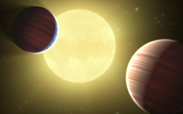 Dibujo artístico de los dos planetas similares a Saturno.