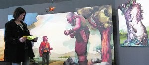 Una persona recorre la exposición del MuVIM sobre los hermanos Grimm.  ::
                             JUANJO MONZÓ/